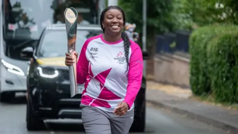 Getty Images Gabriella Drysdale-Reid carrying the baton