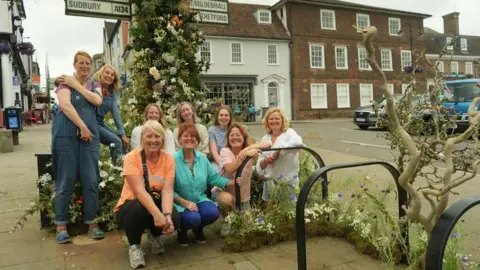 BBC The team behind the 'flash flower' display