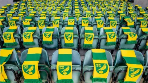 Norwich City Football Club Scarves on the Norwich City seats, representing the number of people who took their own life in East Anglia within a year