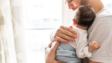 Getty Images Dad and baby