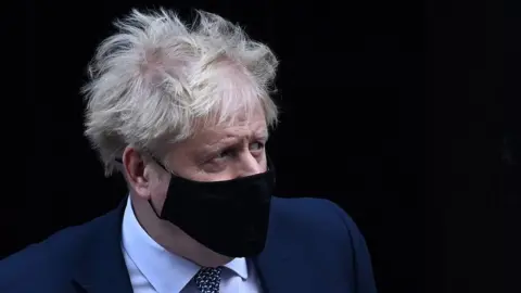 EPA Boris Johnson in a mask leaving No 10