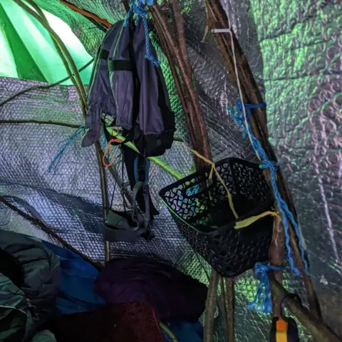 A makeshift camp up the Rochford oak tree