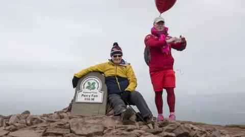 Paul Griffiths/Help for Heroes Des Lally at the summit of Pen y Fan with his dad