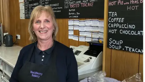 Karen Doyle speaking to the BBC in her bakery