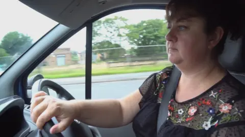 Christine driving van.