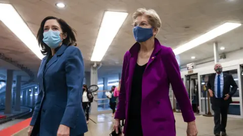 EPA Democratic Senator from Washington Maria Cantwell (L) and Democratic Senator from Massachusetts Elizabeth Warren (R) walk to the Senate chamber as the Senate meets, 5 March