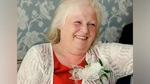 Family Handout Esther Martin sitting down and smiling