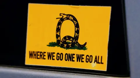 Reuters A sticker that references the QAnon slogan is seen on a truck that participated in a caravan convoy in Adairsville, Georgia, U.S. September 5, 2020