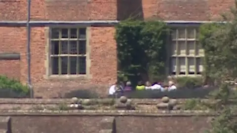 Theresa May and cabinet ministers in the ground of Chequers