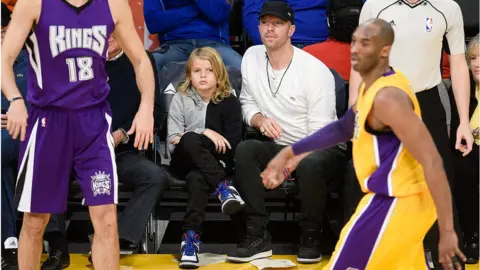 Getty Images Moses seen with his father in Los Angeles in the year the crash occured