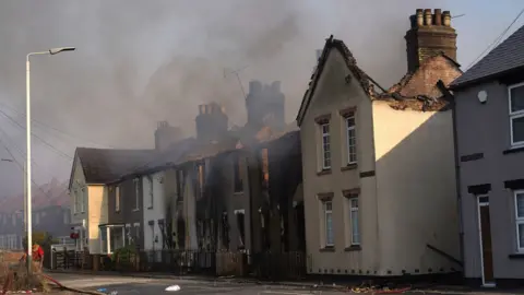 PA Media The scene of a blaze in the village of Wennington, east London