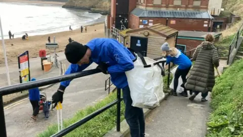 Litter pickers at Cullercoats