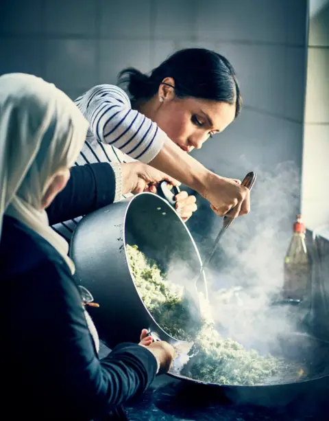 Reuters The Duchess of Sussex at the Hubb Community Kitchen