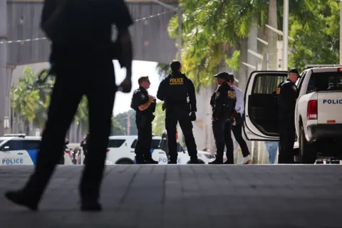 Getty Images Law enforcement officials stand guard at a transit stop outside of the Wilkie D. Ferguson Jr. federal courthouse on June 13, 2023 in Miami, Florida