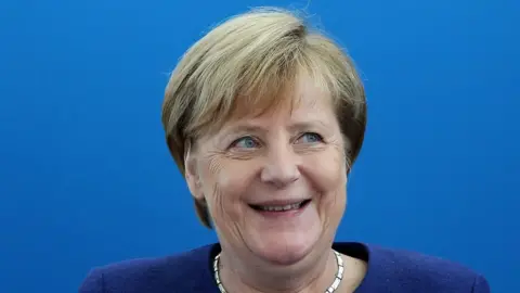 Getty Images Angela Merkel laughs at a meeting of the CDU governing board in Berlin, Germany on 15 October 2018.