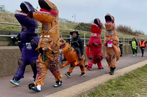 Graeme Lloyd Dinosaurs take part in Lee on Solent's parkrun