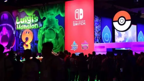 AFP/Getty Images Gaming fans play wait in long lines to play new Nintendo Switch games at E3 2019