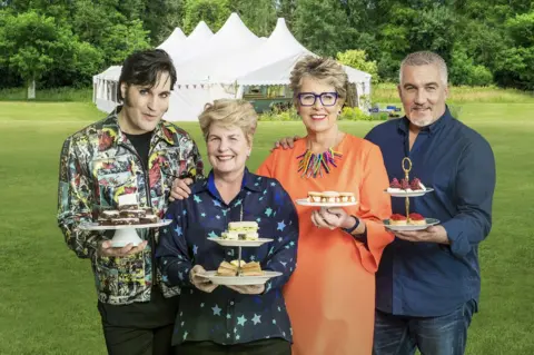 PA The Great British Bake Off hosts