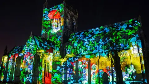 Getty Images Paisley Abbey is illuminated during a photocall for an installation entitled 'About Us', created by 59 Productions, as part of the UNBOXED: Creativity in the UK event, in Paisley, Scotland on February 28, 2022