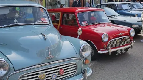 Rob Coombes A duck egg blue 850 Mini and a red Morris Minor Traveller