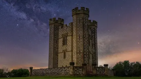 Janette Britton/SDNPA A tower is shown surrounded by a starry sky