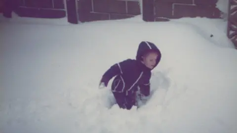 Family photo Neil in the snow aged three