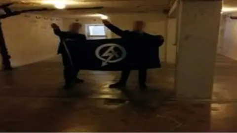 West Midlands Police Alex Davies and another man pictured doing a Nazi salute