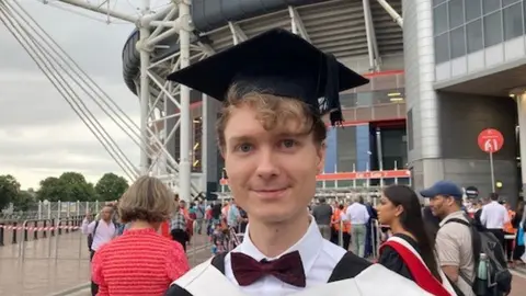 Economics graduate Harrison Badham,24,