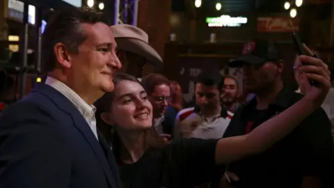 Getty Images Ted Cruz and a supporter