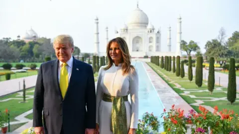 Getty Images US President Donald Trump and First Lady Melania Trump pose as they visit the Taj Mahal in Agra on February 24, 2020