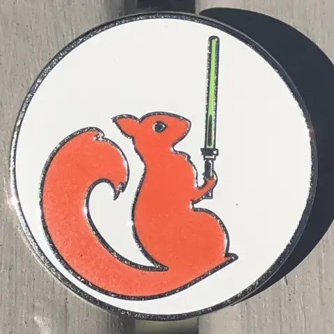 BBC Emblem of squirrel with lightsaber