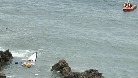 Mumbles Coastguard part of sunken boat in sea