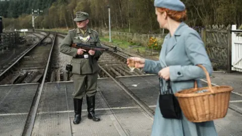 Getty Images A World War II re-enactor dressed as a German soldier at Levisham Station, near Pickering