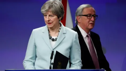 Reuters Theresa May and Jean-Claude Juncker