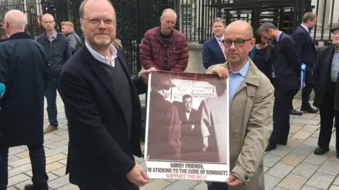 BBC Trevor Birney and Barry McCaffrey with NUJ poster