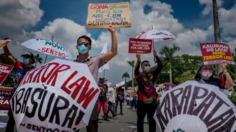 Ezra Acayan Protesters wearing facemasks take part in a protest against President Duterte on July 27, 2020 in Quezon city, Metro Manila, Philippines