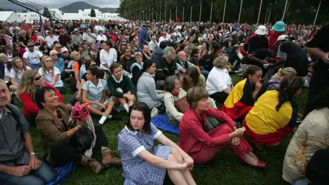 Getty Images Australians gather to watch the government's long-awaited apology to the Stolen Generations in 2008