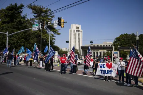 Getty Images Supporters outside Walter Reed
