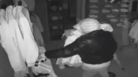 Spaceboy UK CCTV image of thief taking clothes