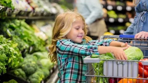 Getty Images child in the veg aisle