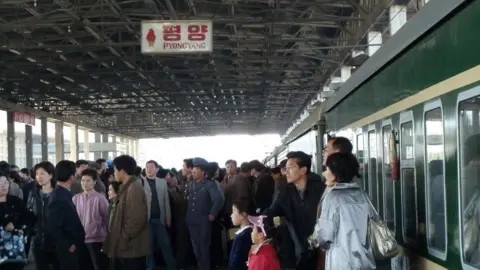 AFP/Getty Passengers crowd the platform at the Pyongyang Railway Station as a train prepares to depart for Beijing