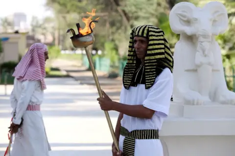 EPA Actors wearing Pharaonic costumes perform during a Pharaonic Wedding, a new tourist attraction at the Pharaonic Village in Giza, Egypt, 05 July 2021.