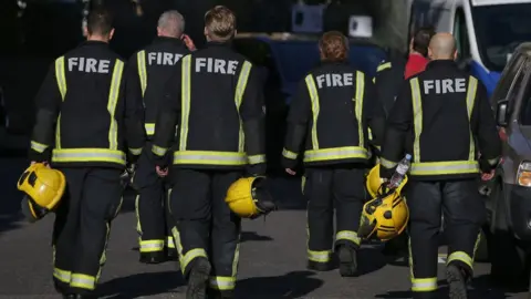 Getty Images Firefighters at the scene of Grenfell Tower