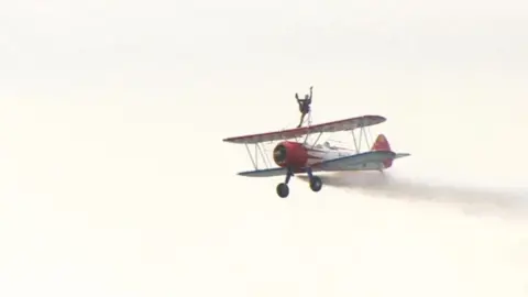 Wingwalker on biplane