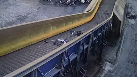 Northamptonshire Police Conveyor belt containing e-scooters