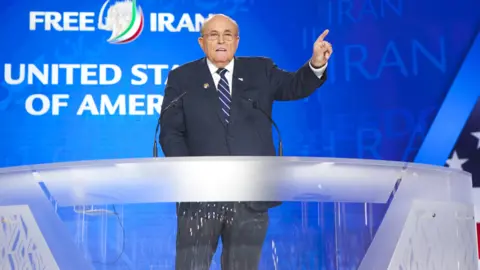 Getty Images Rudy Giuliani speaking at the MEK's Free Iran gathering