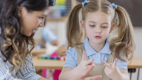 Getty Images Teacher teaching maths