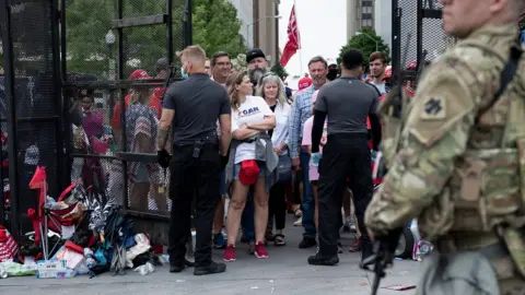 AFP Supporters of US President Donald Trump queue to attend a rally in Tulsa, Oklahoma (20 June 2020)