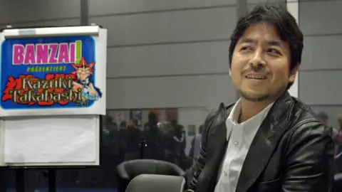Peter Endig/EPA/Shutterstock Manga Star and Inventor of Yu-gi-oh Cards Japanese Cartoonist Kazuki Takahashi at the Leipzig Book Fair Saturday 19 March 2005