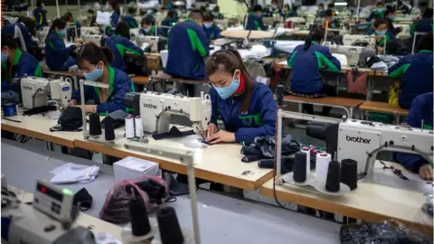 Getty Images Employees produce protective face masks at TNG (Thai Nguyen Garment) factory, 1.5 hours drive north of Hanoi, on February 6, 2020 in Thai Nguyen City, Vietnam.